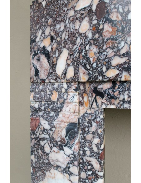 Antique Art Deco fireplace mantel in variegated Africano marble. This marble fireplace surround is genuine, hand-carved.