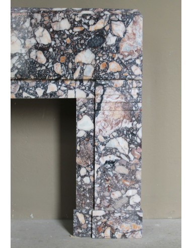 Antique Art Deco fireplace mantel in variegated Africano marble. This marble fireplace surround is genuine, hand-carved.