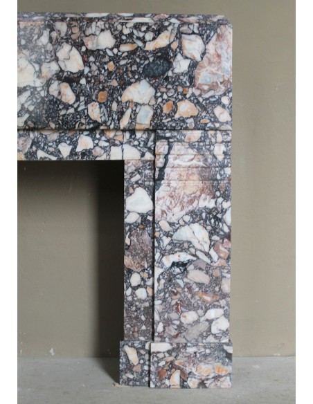 Antique Art Deco fireplace mantel in variegated Africano marble. This marble fireplace surround is genuine, hand-carved.