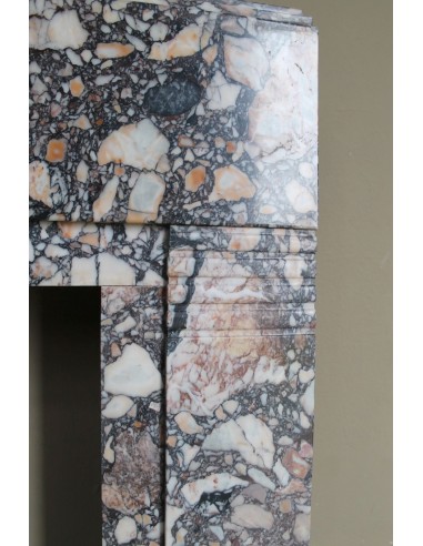 Antique Art Deco fireplace mantel in variegated Africano marble. This marble fireplace surround is genuine, hand-carved.