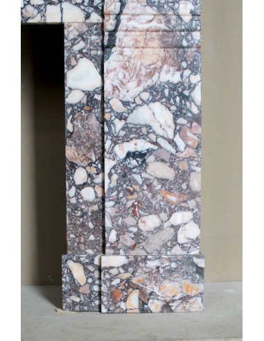 Antique Art Deco fireplace mantel in variegated Africano marble. This marble fireplace surround is genuine, hand-carved.