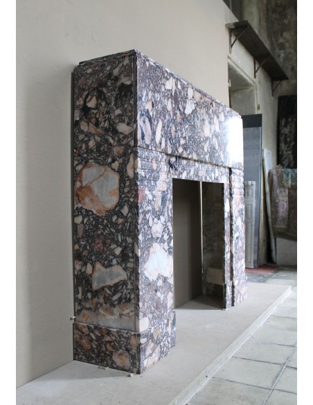 Antique Art Deco fireplace mantel in variegated Africano marble. This marble fireplace surround is genuine, hand-carved.