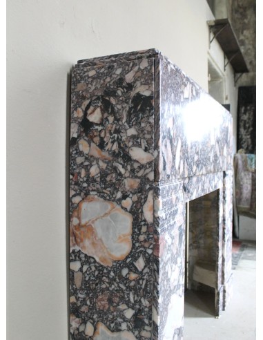Antique Art Deco fireplace mantel in variegated Africano marble. This marble fireplace surround is genuine, hand-carved.