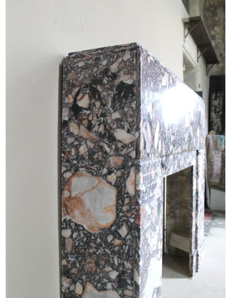 Antique Art Deco fireplace mantel in variegated Africano marble. This marble fireplace surround is genuine, hand-carved.