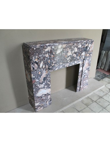 Antique Art Deco fireplace mantel in variegated Africano marble. This marble fireplace surround is genuine, hand-carved.
