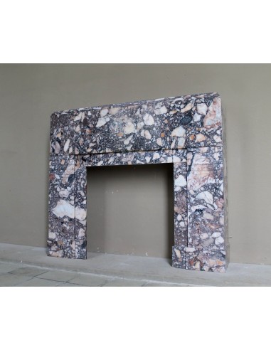 Antique Art Deco fireplace mantel in variegated Africano marble. This marble fireplace surround is genuine, hand-carved.