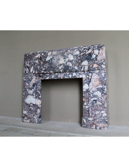 Antique Art Deco fireplace mantel in variegated Africano marble. This marble fireplace surround is genuine, hand-carved.