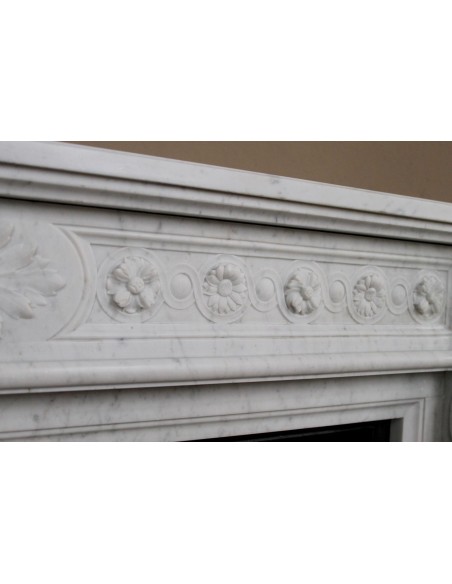 Antique Neoclassical “Macaron” fireplace mantel with exquisitely refined floral sculptural details, in white Carrara marble
