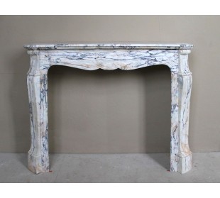 Antique Baroque mantel carved in rare Calacatta Gold marble with veining in shades of violet, gold, and white.