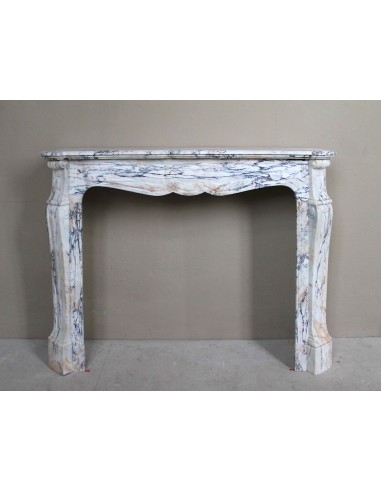 Antique Baroque mantel carved in rare Calacatta Gold marble with veining in shades of violet, gold, and white.