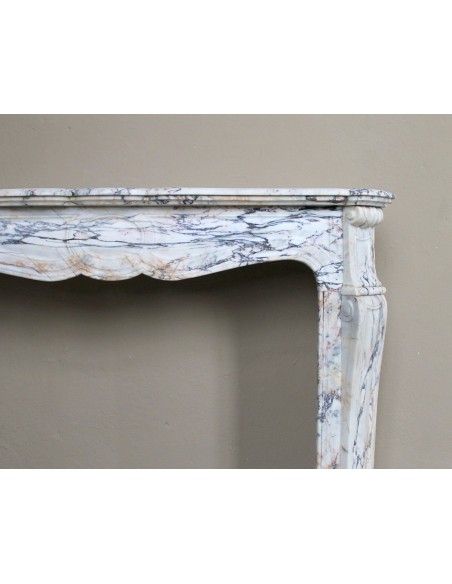 Antique Baroque mantel carved in rare Calacatta Gold marble with veining in shades of violet, gold, and white.