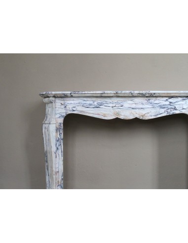 Antique Baroque mantel carved in rare Calacatta Gold marble with veining in shades of violet, gold, and white.