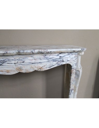 Antique Baroque mantel carved in rare Calacatta Gold marble with veining in shades of violet, gold, and white.