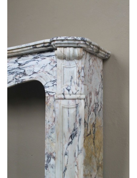Antique Baroque mantel carved in rare Calacatta Gold marble with veining in shades of violet, gold, and white.