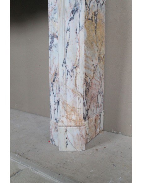 Antique Baroque mantel carved in rare Calacatta Gold marble with veining in shades of violet, gold, and white.