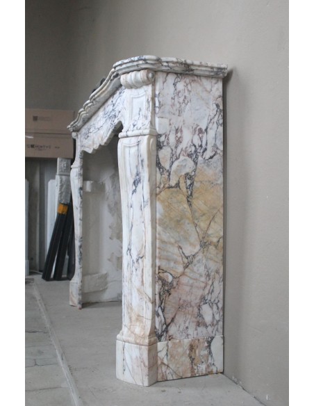 Antique Baroque mantel carved in rare Calacatta Gold marble with veining in shades of violet, gold, and white.
