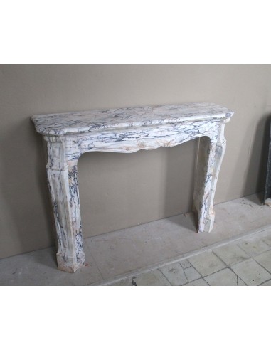 Antique Baroque mantel carved in rare Calacatta Gold marble with veining in shades of violet, gold, and white.