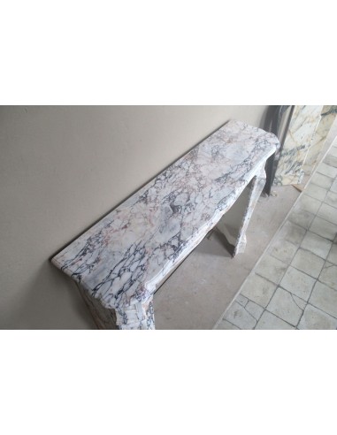 Antique Baroque mantel carved in rare Calacatta Gold marble with veining in shades of violet, gold, and white.