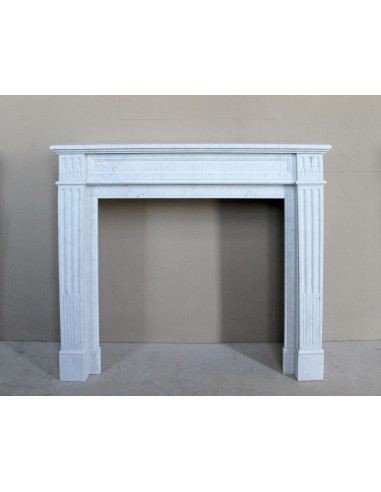 Louis XVI “Cannelure” fireplace mantel carved in “Pure” Bianco Carrara marble. A sober, elegant, and linear antique fireplace.