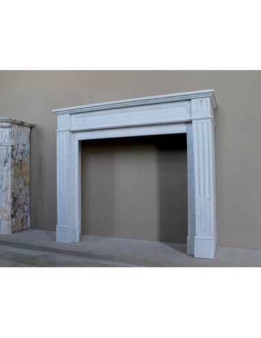 Louis XVI “Cannelure” fireplace mantel carved in “Pure” Bianco Carrara marble. A sober, elegant, and linear antique fireplace.