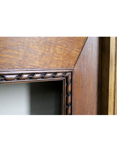 Charming small-scale Louis XVI “Olive Branch” fireplace mantel carved in oak wood, complete with insert and closure.