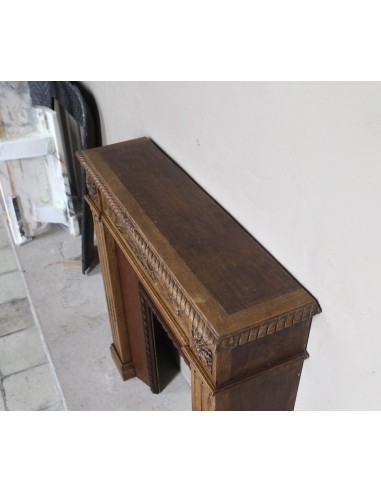 Charming small-scale Louis XVI “Olive Branch” fireplace mantel carved in oak wood, complete with insert and closure.