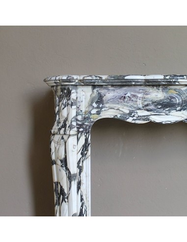 Louis XV “Pompadour” fireplace mantel in Breccia Medicea marble, featuring strong purple, green, gold and white veining.