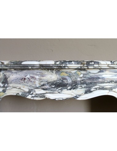 Louis XV “Pompadour” fireplace mantel in Breccia Medicea marble, featuring strong purple, green, gold and white veining.