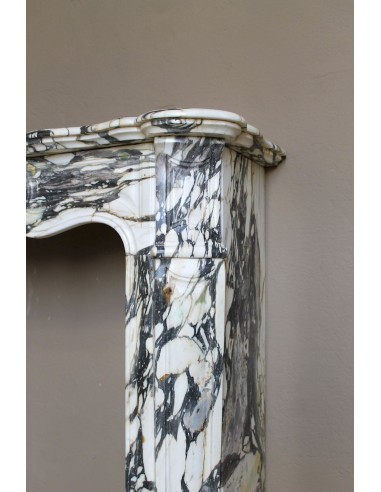 Louis XV “Pompadour” fireplace mantel in Breccia Medicea marble, featuring strong purple, green, gold and white veining.