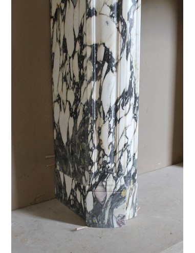 Louis XV “Pompadour” fireplace mantel in Breccia Medicea marble, featuring strong purple, green, gold and white veining.