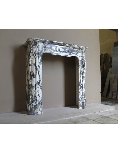 Louis XV “Pompadour” fireplace mantel in Breccia Medicea marble, featuring strong purple, green, gold and white veining.