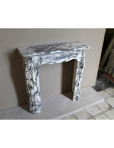 Louis XV “Pompadour” fireplace mantel in Breccia Medicea marble, featuring strong purple, green, gold and white veining.