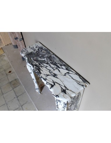 Louis XV “Pompadour” fireplace mantel in Breccia Medicea marble, featuring strong purple, green, gold and white veining.