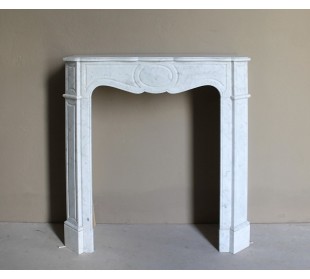 Antique baroque “Pompadour” mantelpiece in white marble of small and appealing size. A genuine, Parisian, iconic fire surround.