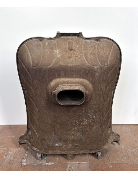 Antique “Lux” stove in green enameled cast iron, with floral and foliate decorations. A genuine and rare fireplace stove.