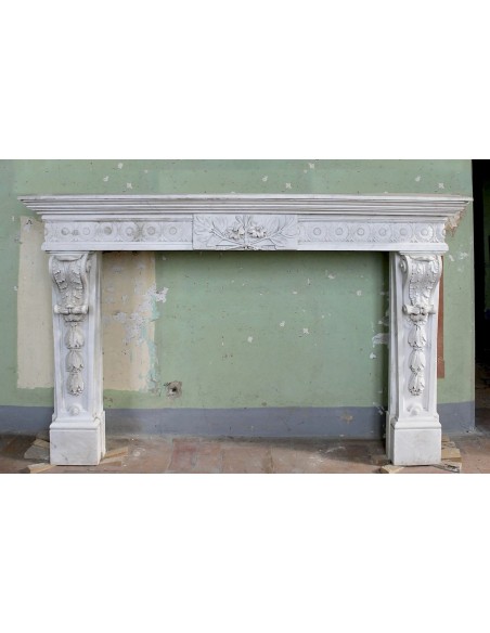 Exceptional large-scale Neoclassical fireplace carved in white Carrara marble. This model can also be found at Versailles.