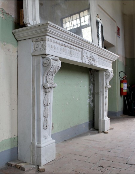 Exceptional large-scale Neoclassical fireplace mantel carved in white Carrara marble. This model can also be found at Versailles