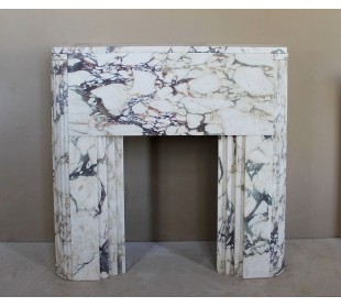Exceptional Art Deco fireplace mantel in Gold Calacatta Viola marble, featuring violet and gold veins on a white background.