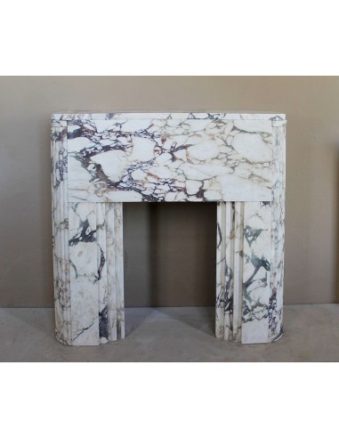 Exceptional Art Deco fireplace mantel in Gold Calacatta Viola marble, featuring violet and gold veins on a white background.