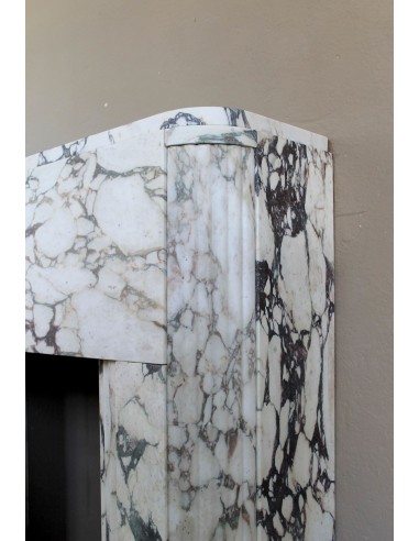 Exceptional Art Deco fireplace mantel in Gold Calacatta Viola marble, featuring violet and gold veins on a white background.