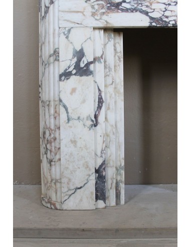 Exceptional Art Deco fireplace mantel in Gold Calacatta Viola marble, featuring violet and gold veins on a white background.