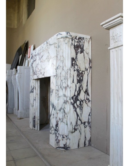 Exceptional Art Deco fireplace mantel in Gold Calacatta Viola marble, featuring violet and gold veins on a white background.