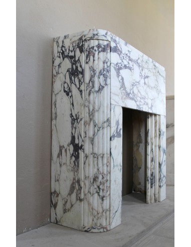 Exceptional Art Deco fireplace mantel in Gold Calacatta Viola marble, featuring violet and gold veins on a white background.