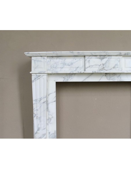 Large antique Neoclassical “Cannelure” fireplace mantel carved in beautifully veined white Arabescato marble.