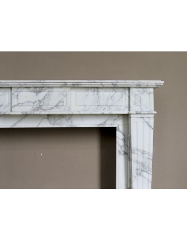 Large antique Neoclassical “Cannelure” fireplace mantel carved in beautifully veined white Arabescato marble.