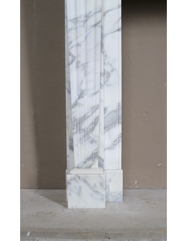 Large antique Neoclassical “Cannelure” fireplace mantel carved in beautifully veined white Arabescato marble.