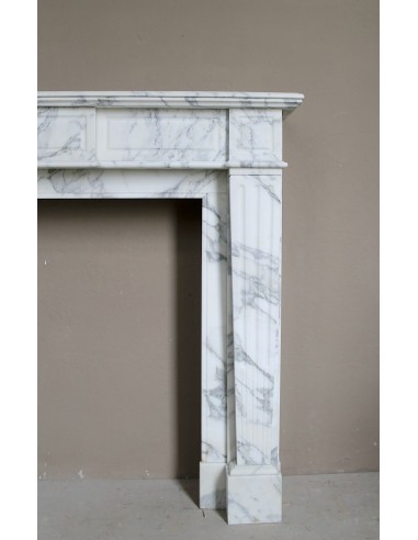Large antique Neoclassical “Cannelure” fireplace mantel carved in beautifully veined white Arabescato marble.