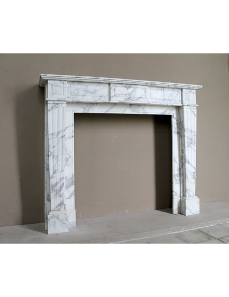 Large antique Neoclassical “Cannelure” fireplace mantel carved in beautifully veined white Arabescato marble.