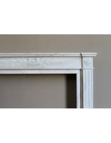 Antique Neoclassical fireplace mantel with olive branch decoration in Cremo Delicato marble, offered at a discounted price.