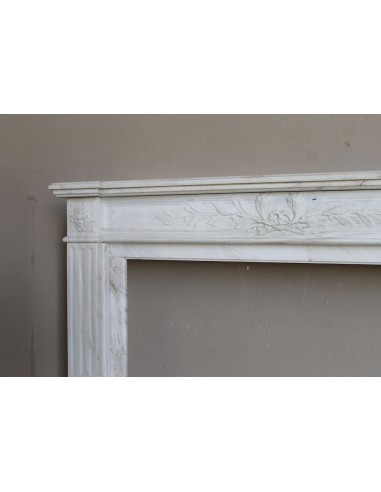 Antique Neoclassical fireplace mantel with olive branch decoration in Cremo Delicato marble, offered at a discounted price.
